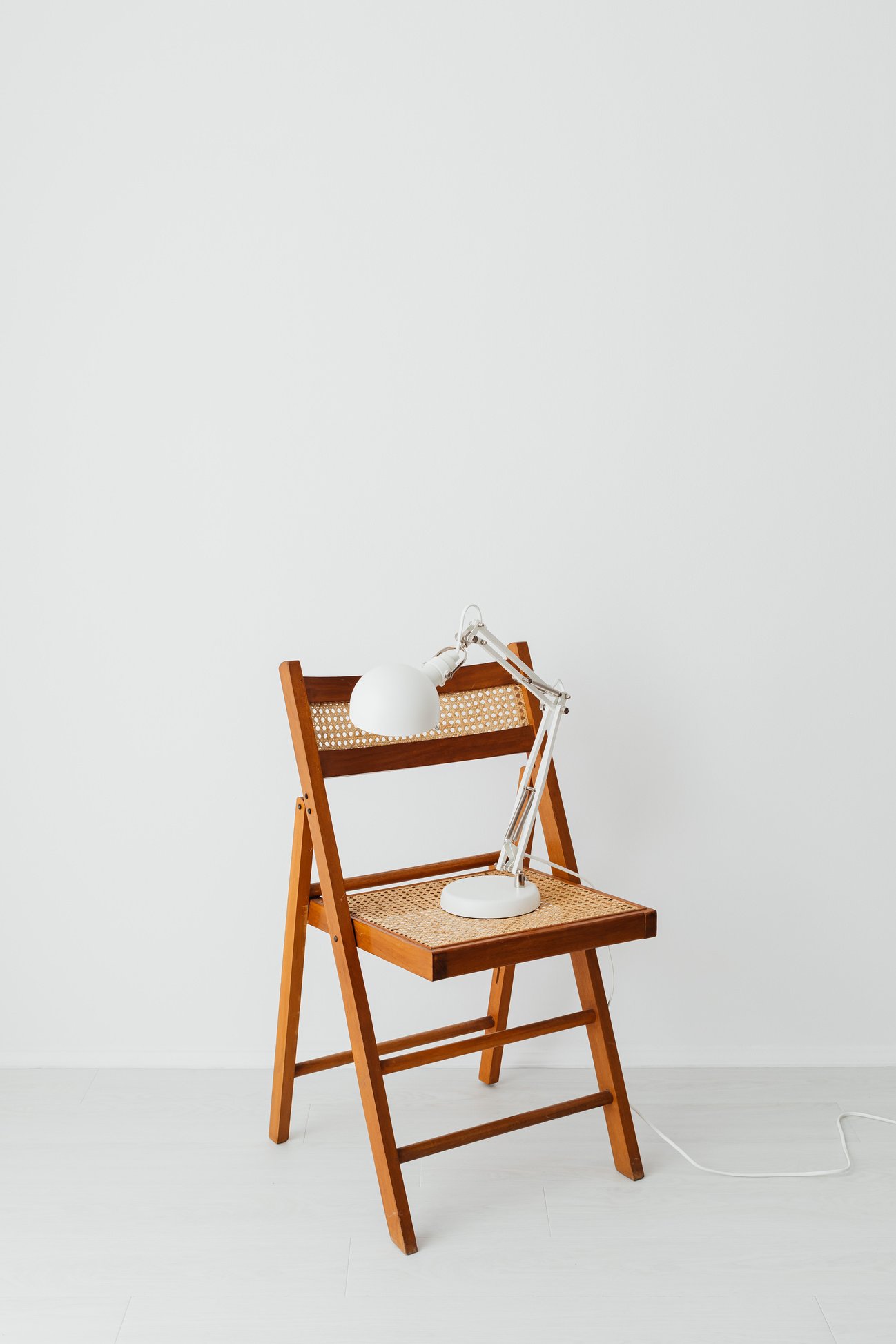 White Ceramic Teapot on Brown Wooden Folding Table